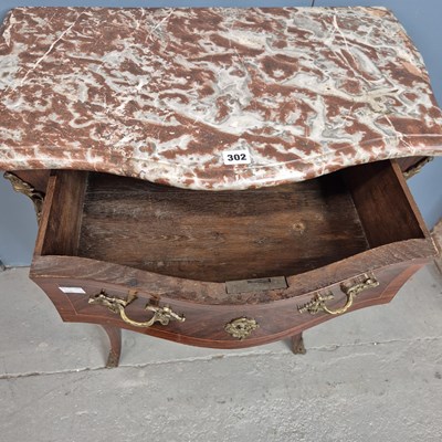 Lot 302 - A red marble topped rosewood commode of three...