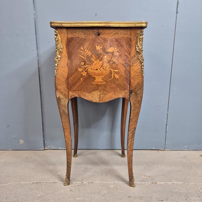 Lot 307 - A floral marquetried rosewood bombe side...