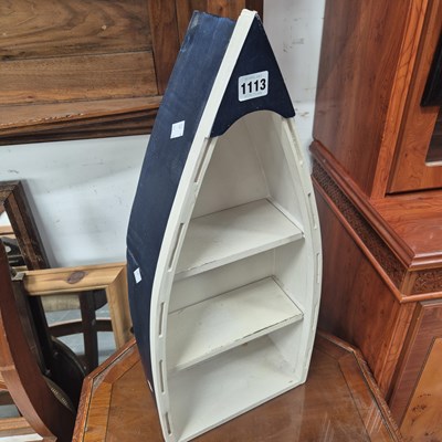 Lot 1113 - A blue and white boat shaped set of wall shelves