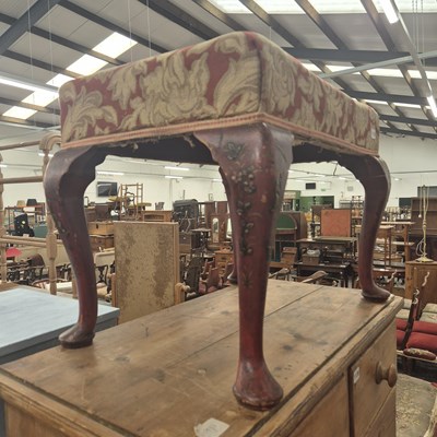 Lot 1119 - A stool with a woven seat cover and on four...