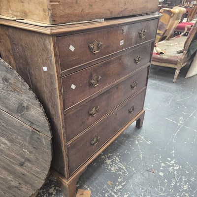 Lot 1121 - A 19th century oak chest of four long drawers