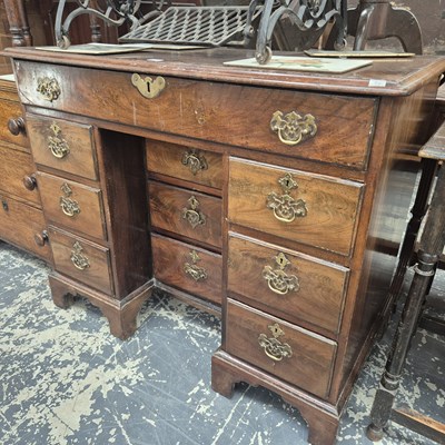 Lot 1127 - A George III mahogany kneehole desk
