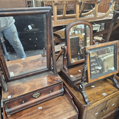 Lot 1129 - A George III mahogany dressing table mirror on...
