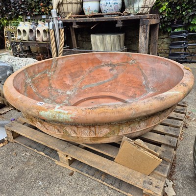 Lot 750 - An impressive terracotta large shallow bowl...