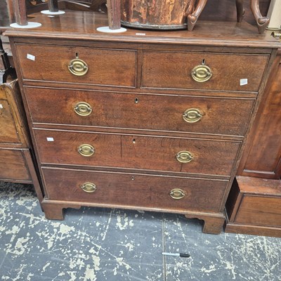 Lot 1134 - A 19th century oak chest of two short and...