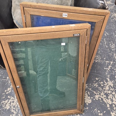Lot 1135 - Two NOBO oak framed glazed notice board wall...