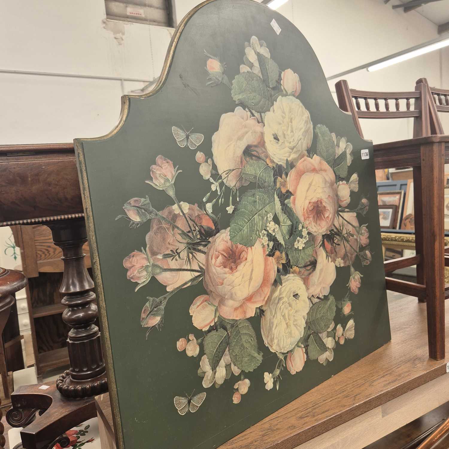 Lot 1136 - A green ground fire screen decorated with pink...