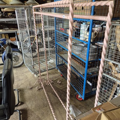 Lot 771 - A pair of vintage wrought iron clothes rails.