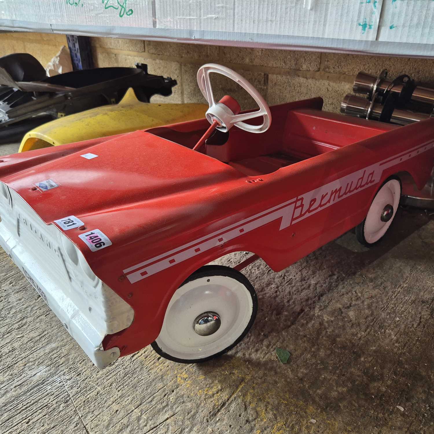 Lot 781 - A vintage Tri-Ang Bermuda, tin plate pedal car.