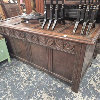 Lot 1145 - An early 18th century oak coffer with an arch...