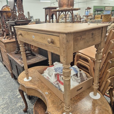 Lot 1004 - An antique pine side table.