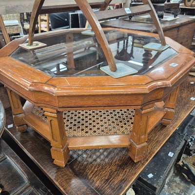 Lot 1147 - A mahogany octagonal coffee table with the...