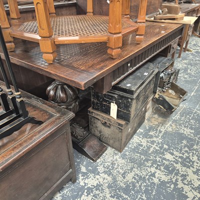 Lot 1148 - A 17th century style oak trestle table on...
