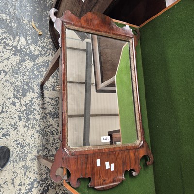 Lot 1019 - A Georgian walnut wall mirror.
