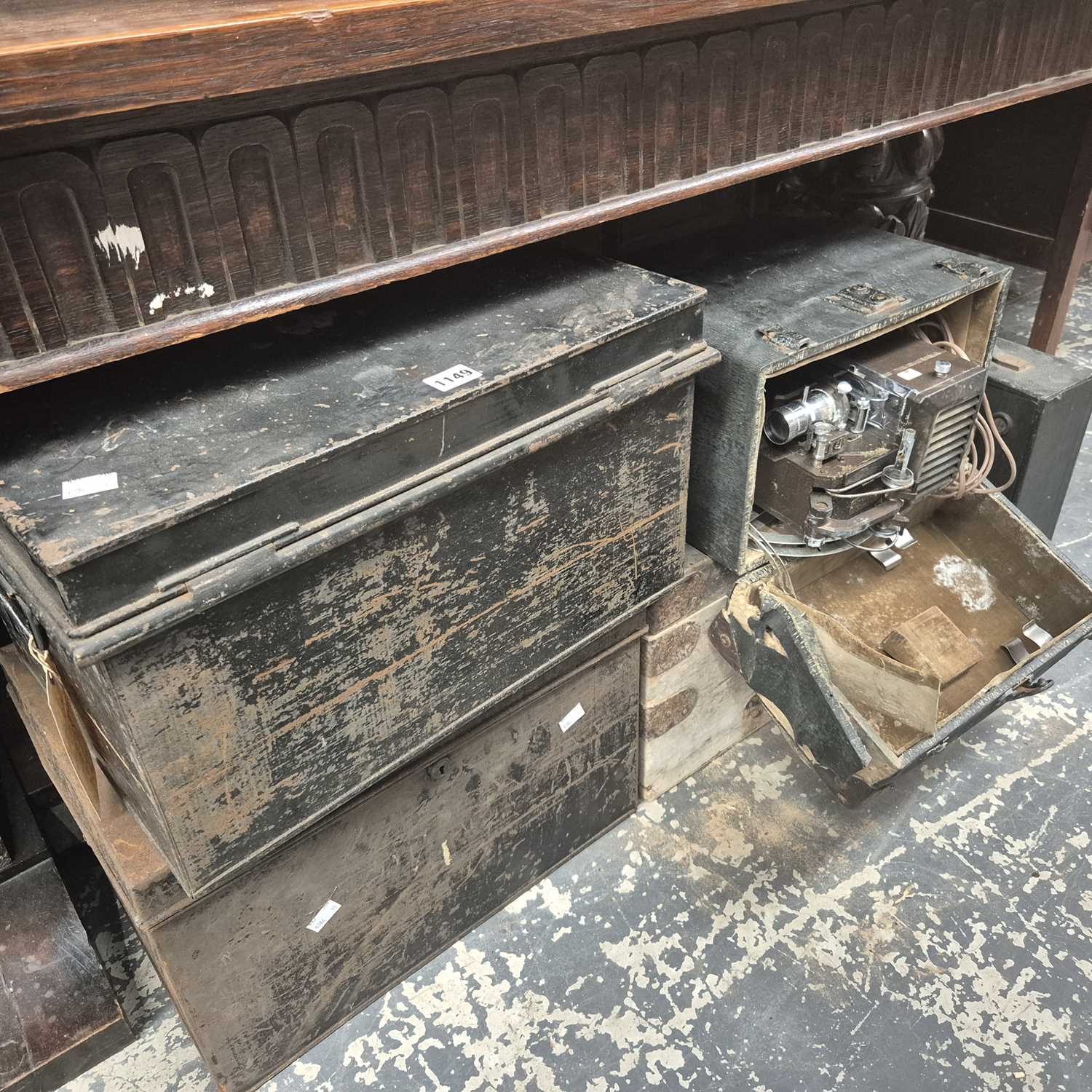 Lot 1149 - A cased film projector, two tin boxes, another...