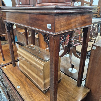 Lot 1038 - A GIII mahogany fold over tea table.