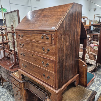 Lot 1043 - A 19th century mahogany bureau.