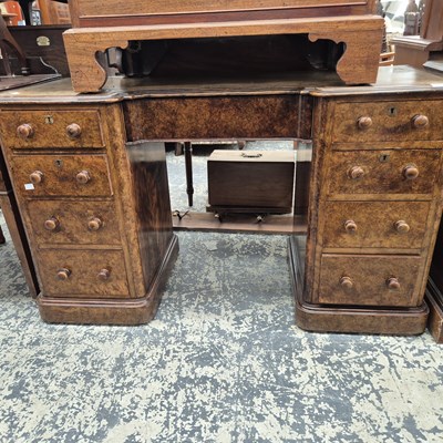 Lot 1044 - A Victorian walnut pedestal desk.