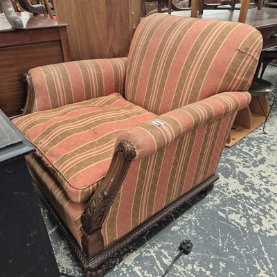 Lot 1048 - An antique show frame club armchair.