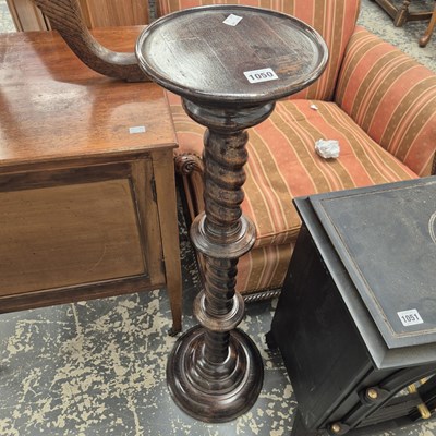 Lot 1050 - An oak occasional table and a wooden towel rack.