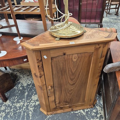 Lot 1052 - An estate made elm corner cabinet and a brass...