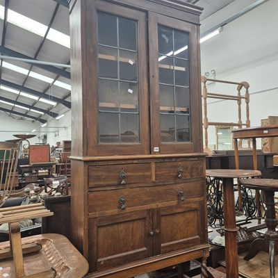 Lot 1157 - A stained pine display cabinet with leaded...