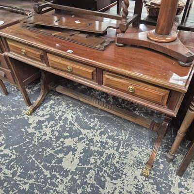 Lot 1159 - A 20th century mahogany three drawer writing...