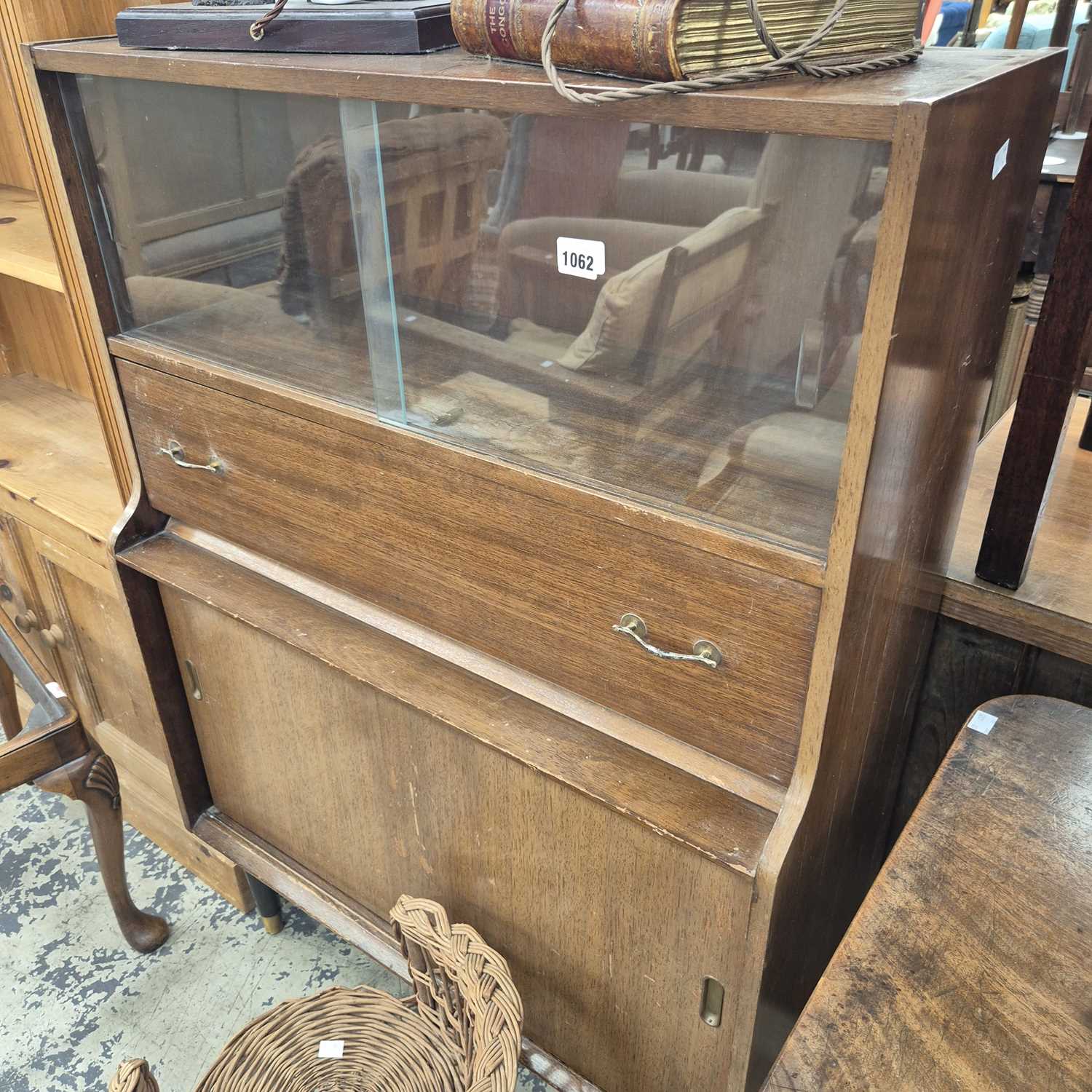 Lot 1062 - A mid-century bookcase cabinet.