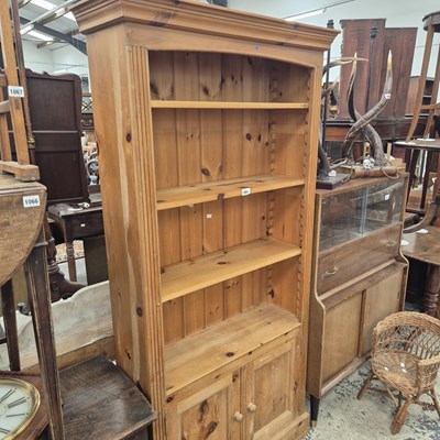 Lot 1064 - A Large pine bookcase.
