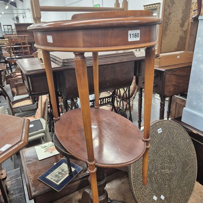Lot 1160 - A 20th century mahogany two oval tier...