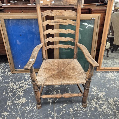 Lot 1091 - A Lancashire ladderback armchair.