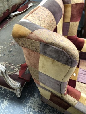Lot 1095 - A wingback armchair.