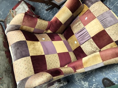Lot 1095 - A wingback armchair.