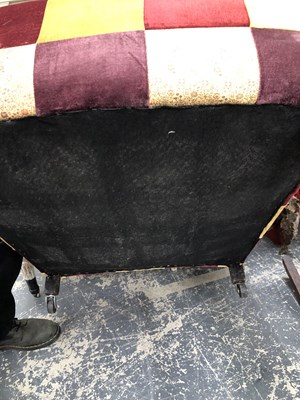 Lot 1095 - A wingback armchair.