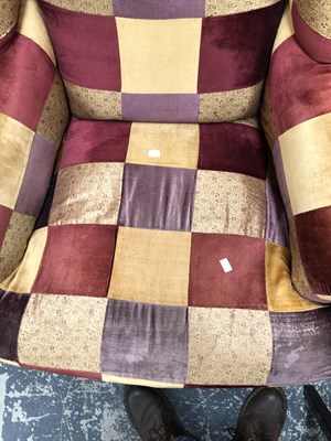 Lot 1095 - A wingback armchair.