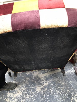 Lot 1095 - A wingback armchair.