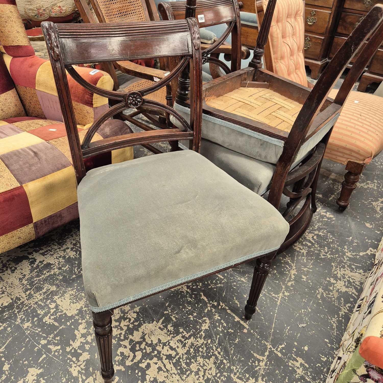 Lot 1097 - A set of four late Georgian dining chairs.