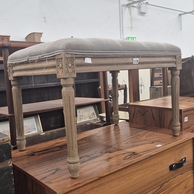 Lot 1176 - An oak stool with an upholstered seat of...