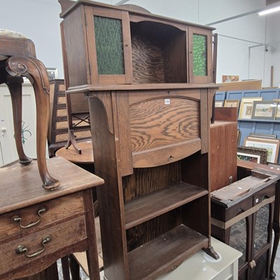 Lot 1181 - An Arts and Crafts oak secretaire with an open...