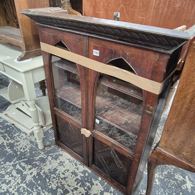 Lot 1183 - An early 20th century oak wall cabinet with...