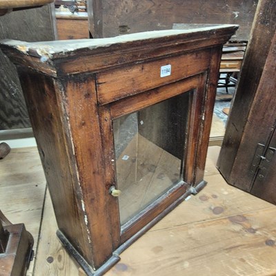 Lot 1194 - A 19th century pine wall cabinet with a glazed...