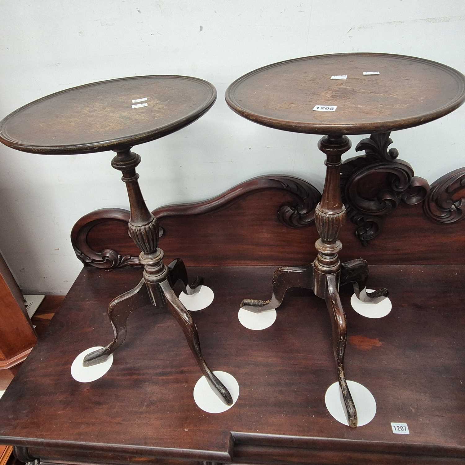 Lot 1205 - A pair of mahogany tripod wine tables