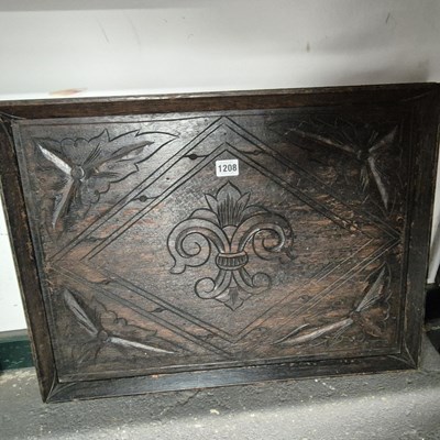 Lot 1208 - An oak tray carved centrally with a fleur de...