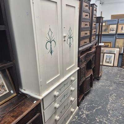 Lot 1346 - A white painted linen press, the doors and...