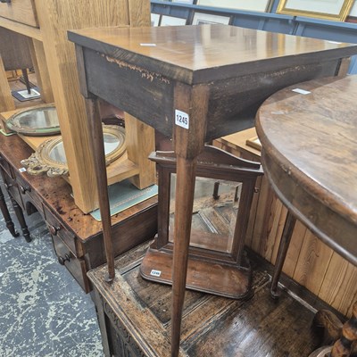 Lot 1245 - A Mahogany occasional table on club feet.