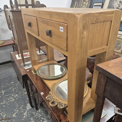 Lot 1247 - An oak hall table.