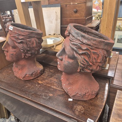 Lot 1254 - A pair of bust form garden planters.