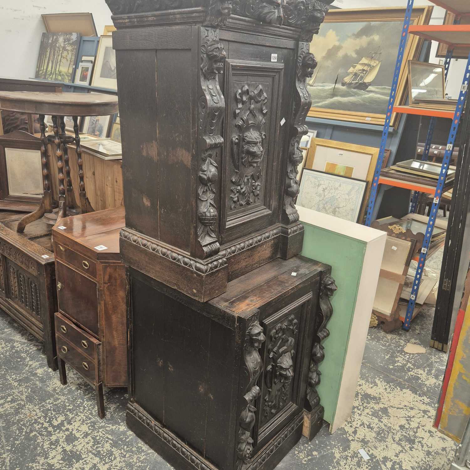 Lot 1258 - Two antique carved oak cabinets.