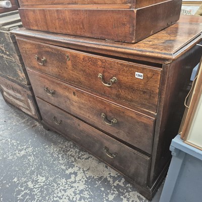 Lot 1260 - A Georgian mahogany three drawer chest.