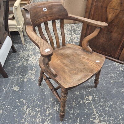 Lot 1297 - A smokers bow armchair.